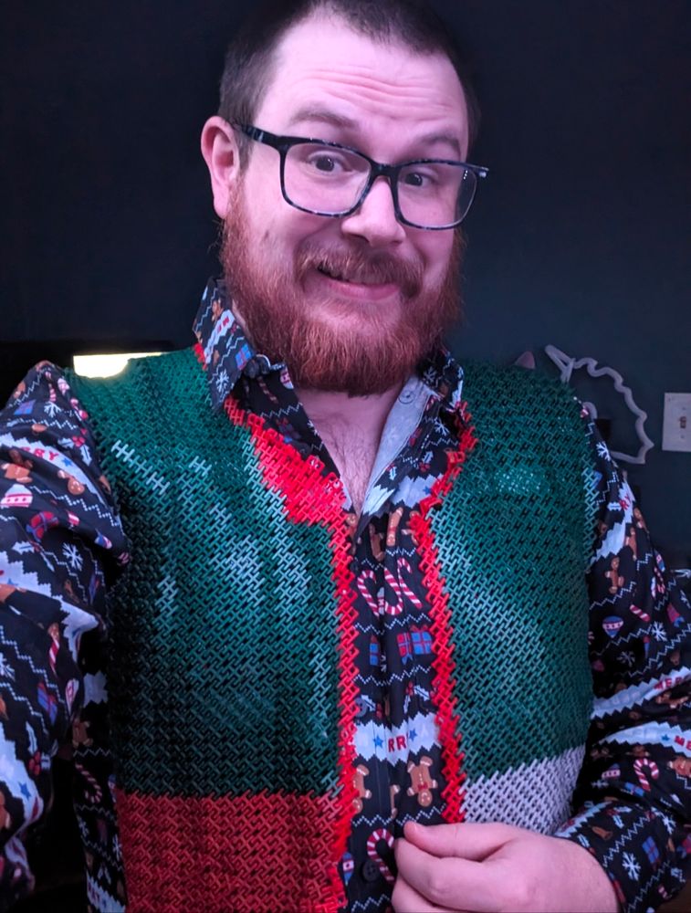 Me wearing my red and green 3d printed vest. 