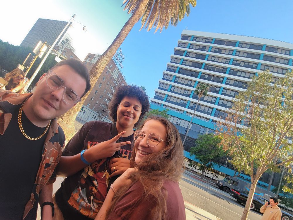 photo of my friends in line. 2 of them are mid-blink and i love them so much