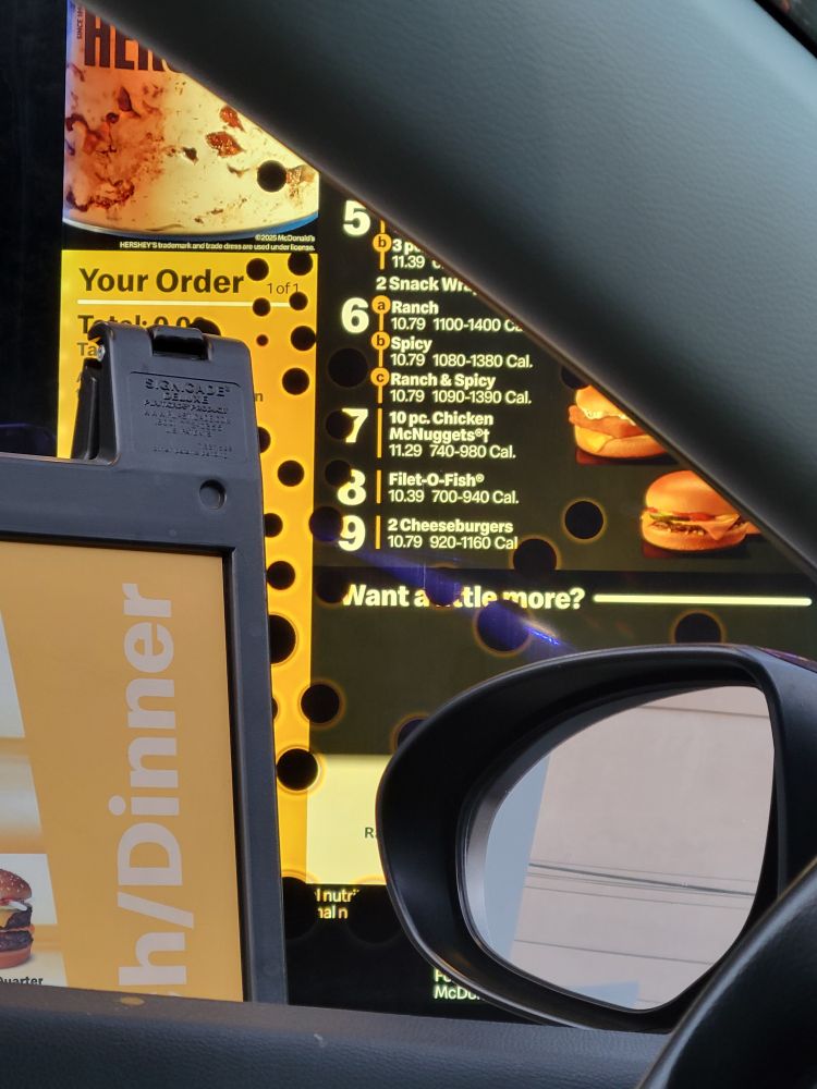 photo of a mcdonalds sign thats got weird holes in it