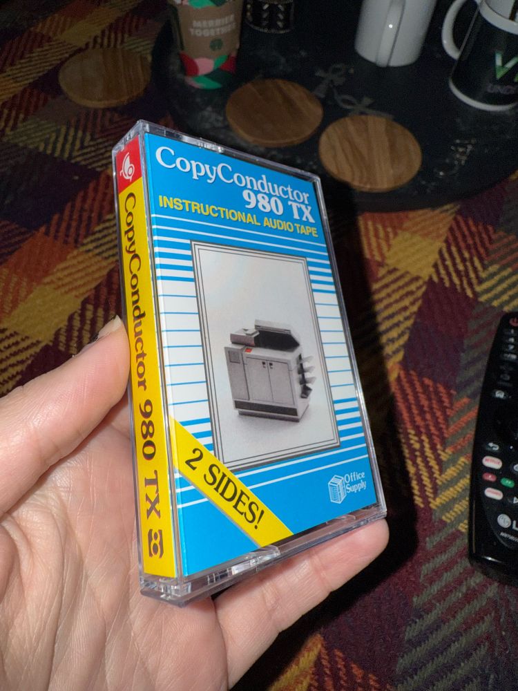 A cassette tape that appears to be an instruction tape for a copy machine from the 80s.