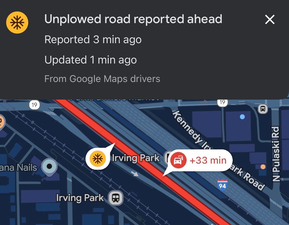 Screenshot of Google Maps featuring a red stretch of highway with a red accident icon and “+33 min” right after a yellow snowflake icon highlighted and defined as “Unplowed road reported ahead”