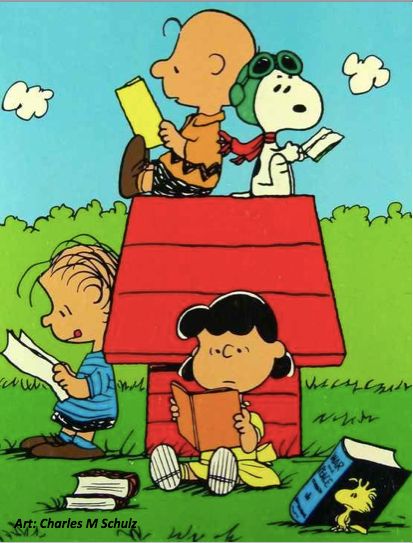 Cartoon by Charles M Schulz showing the Peanuts gang reading - Snoopy, Charlie Brown, Linus, Lucy and Woodstock all with books - Woodstock weighed down by War And Peace!