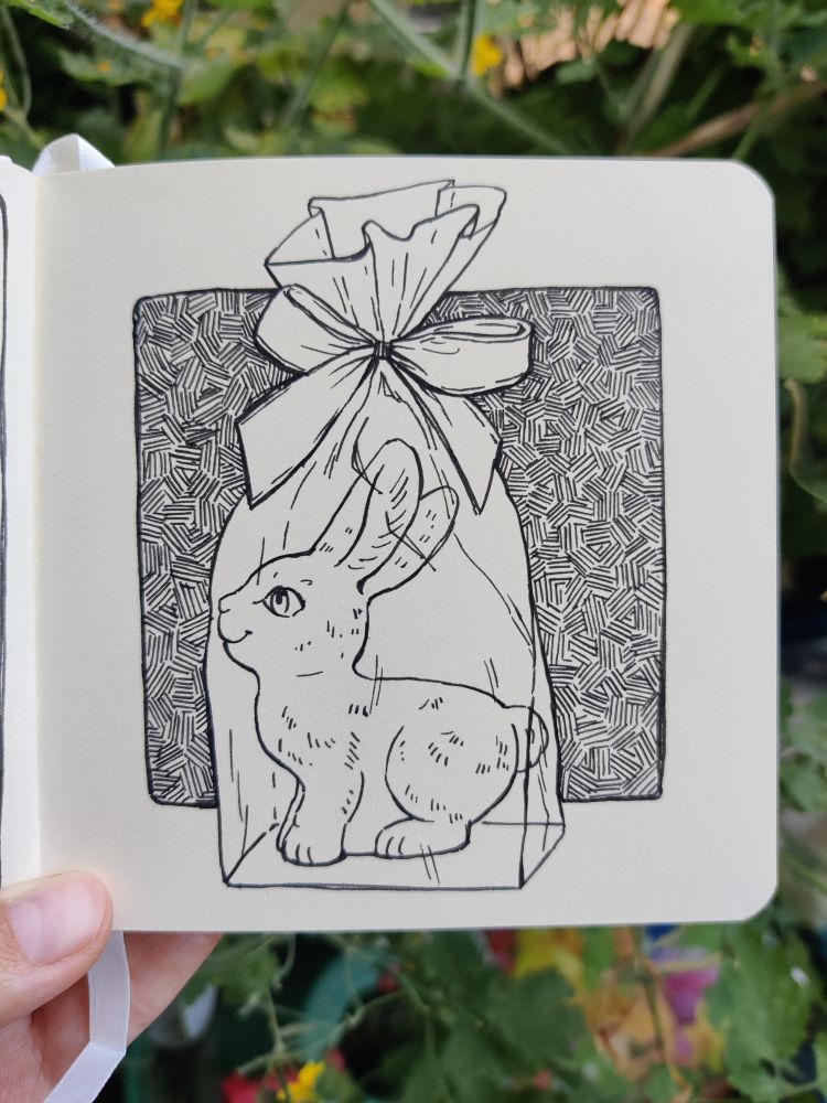 Ink drawing of a chocolate bunny in a foil packaging. 