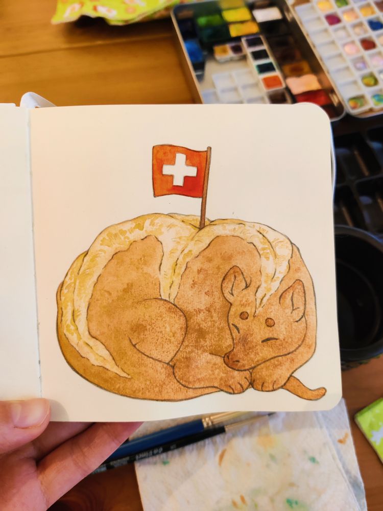 Watercolour drawing of a dragon curled up and sleeping. It has colours and the texture of bread, and it has a small swiss flag sticking out of its back. 
