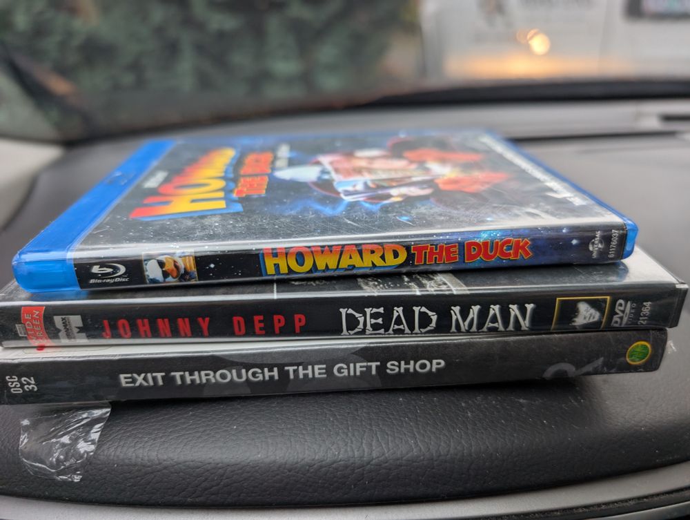 A Blu-Ray of HOWARD THE DUCK and DVDs of DEAD MAN and EXIT THROUGH THE GIFT SHOP
