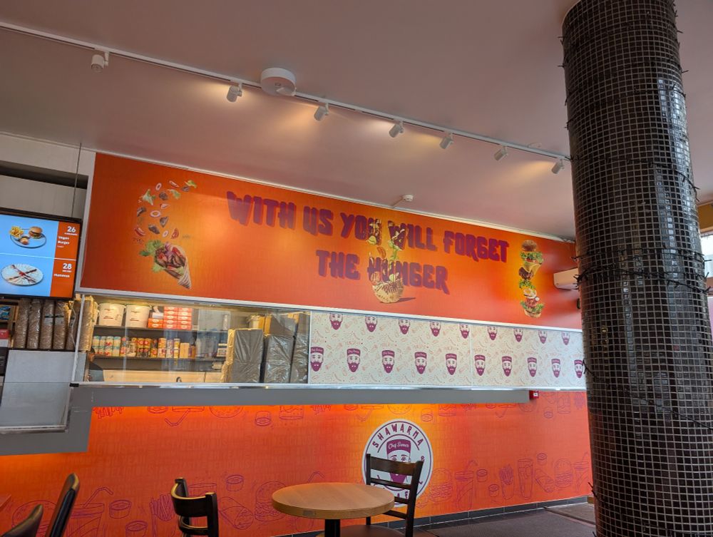 A sign in a shawarma restaurant that reads 
