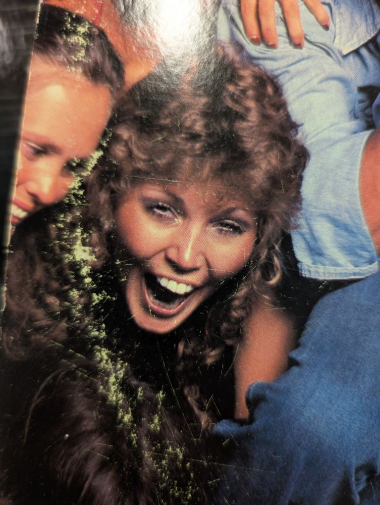 A woman in full mouth open drunken bliss. 