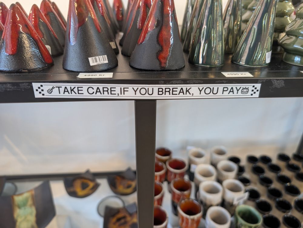 A label on a shelf that reads 