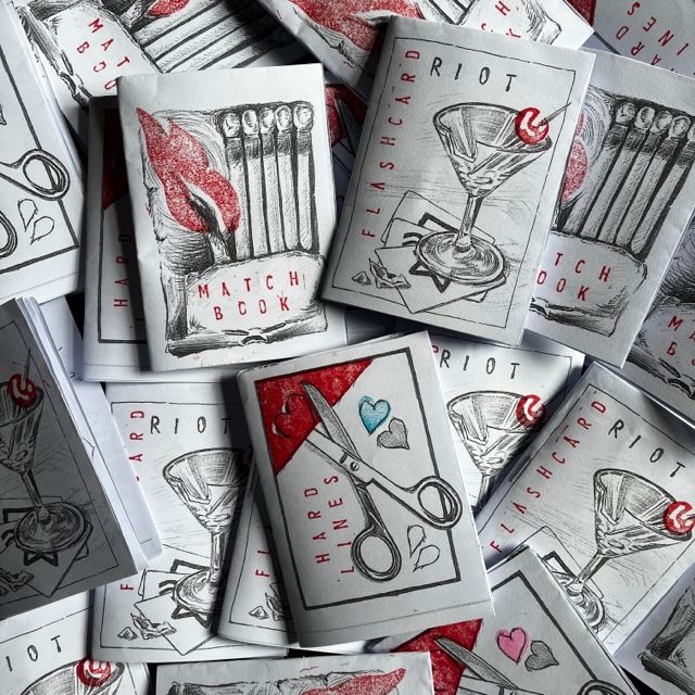 Pile of handmade zines with stamped covers in red showing a match book, a martini glass and some scissors.