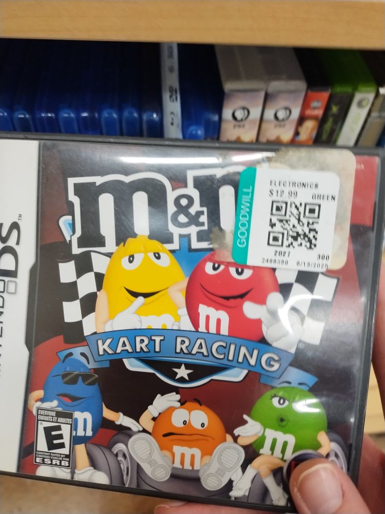 The box for M&Ms kart racing for the DS. It has a goodwill sticker marked 13$