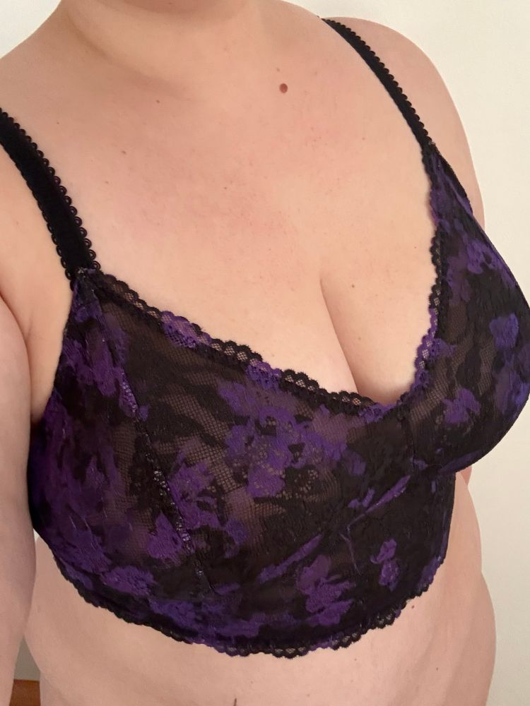 Pic of my torso in a purple and black bralette 