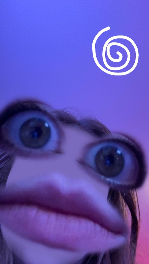 A photo of mousie with the no nose filter and big eyes and mouth. 