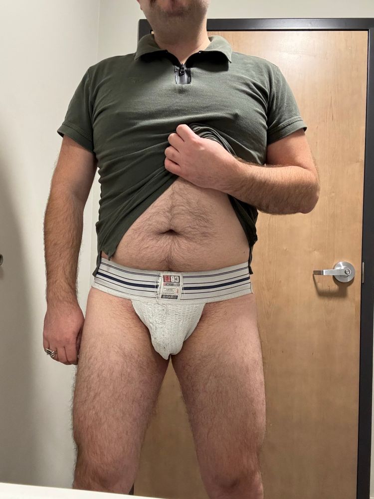 Faust in a thick waistband, white athletic jockstrap.