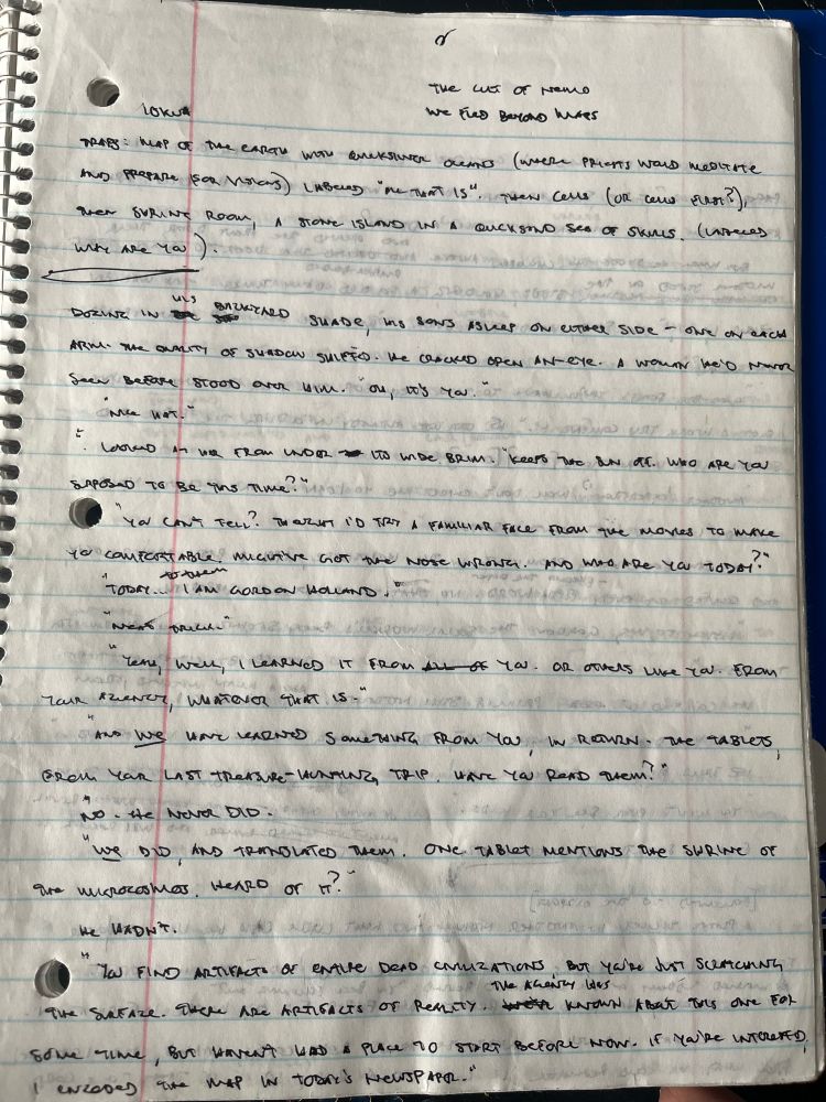 handwritten text in a spiral-bound notebook. paper shows signs of water damage