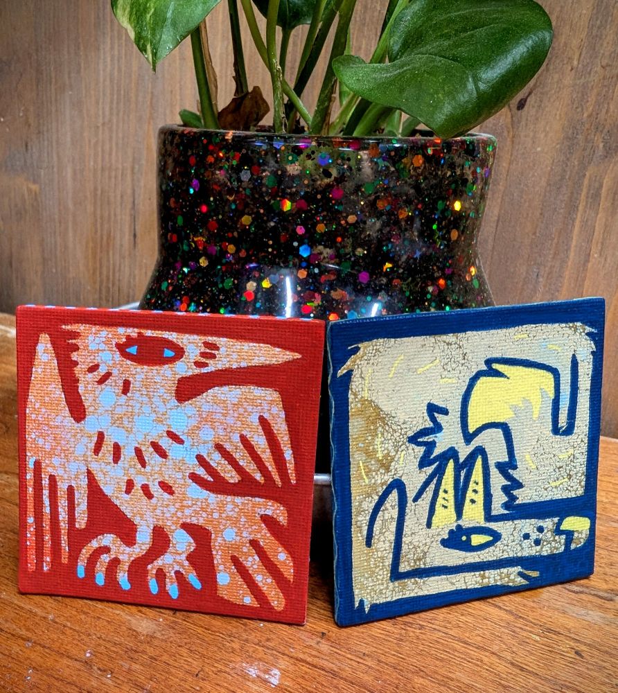 A small painting of a stylized red bird and a blue foxy-looking guy