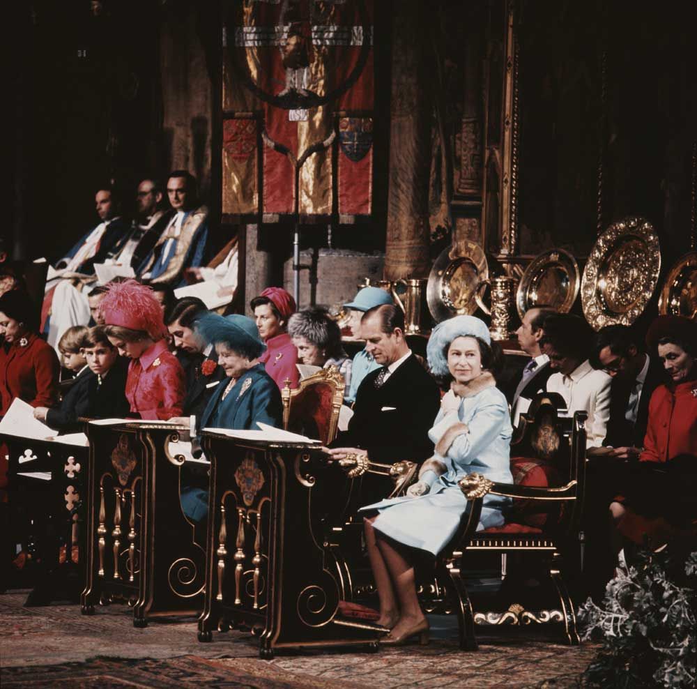 A photograph of Queen Elizabeth II and Prince Philip seated in Westminster Abbey at a service celebrating their silver wedding anniversary in 1972. Seated beside them are other members of the Royal Family including Queen Elizabeth The Queen Mother and Princess Anne.