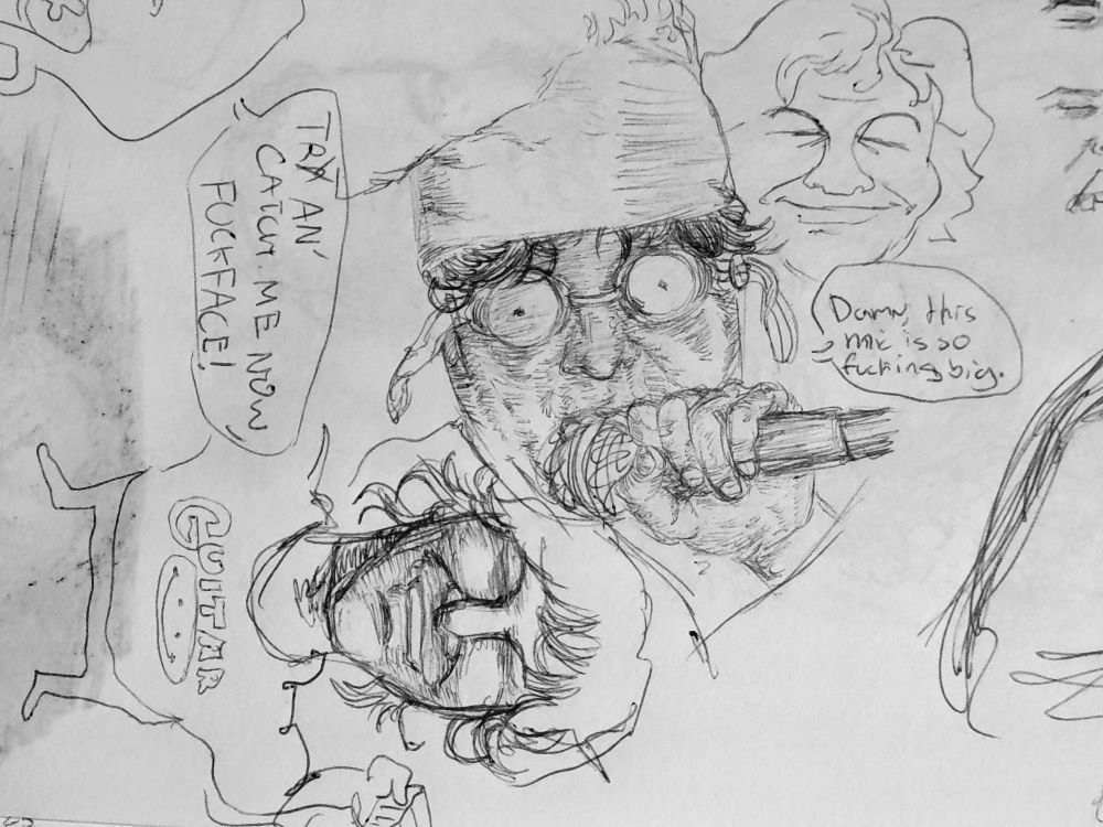 Gene Ween of Ween fame with a microphone that i drew too big on accident. Dean Ween of Moistboyz fame is  perpendicular to Gene Ween, wearing a shirt that says "Guitar" with a smilie under it.