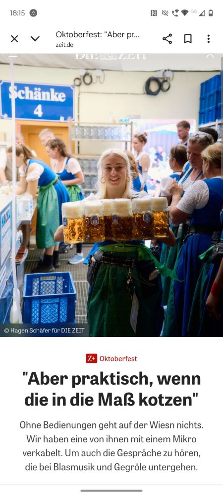 A screenshot of the headline and subheading of an article from Die Zeit: "Aber praktisch, wenn die in die Maß kotzen" (but it's practical, when they vomit in the beer mugs) with a photo of a Wiesnbedienerin who is carrying an indeterminate number of said beer mugs, happily still filled with beer, not puke. It appears to be in the Hofbräuhaus tent.