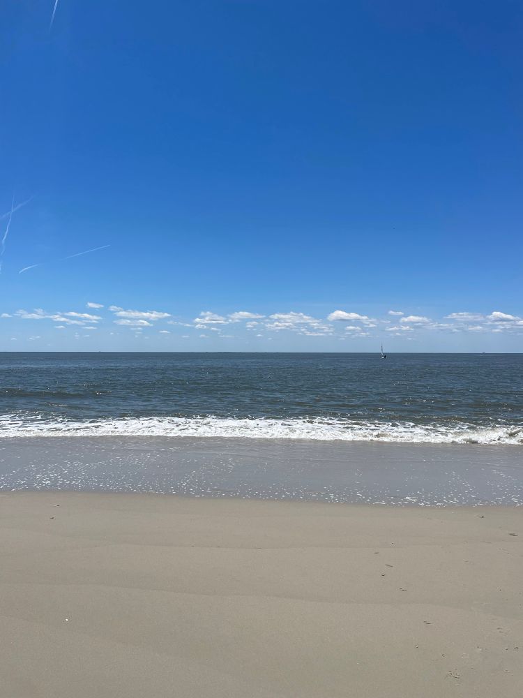 Sandy beach with mild waves in NJ
