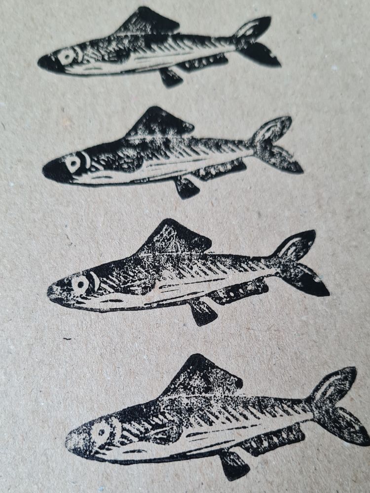 The same close up. The inking is uneven and the prints look textured.