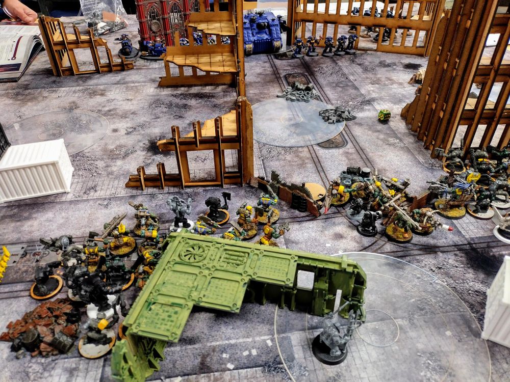 The ultramarines and orks face off across the battlefield 