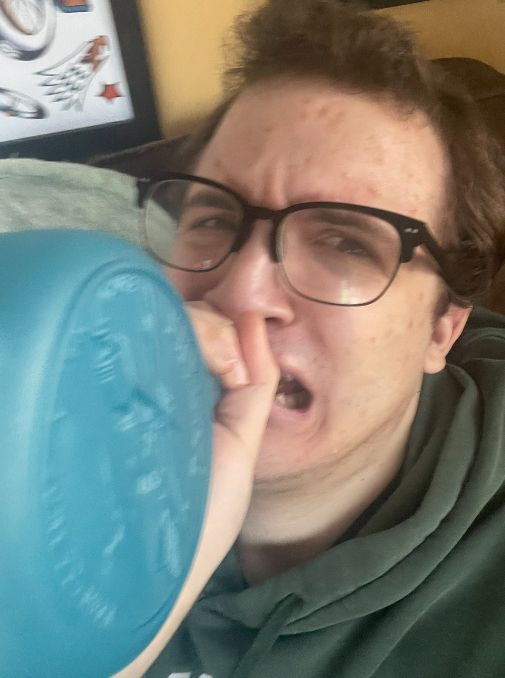 A unpleasant but humorous photo of me clutching the Skylab bottle to my lips while sobbing
