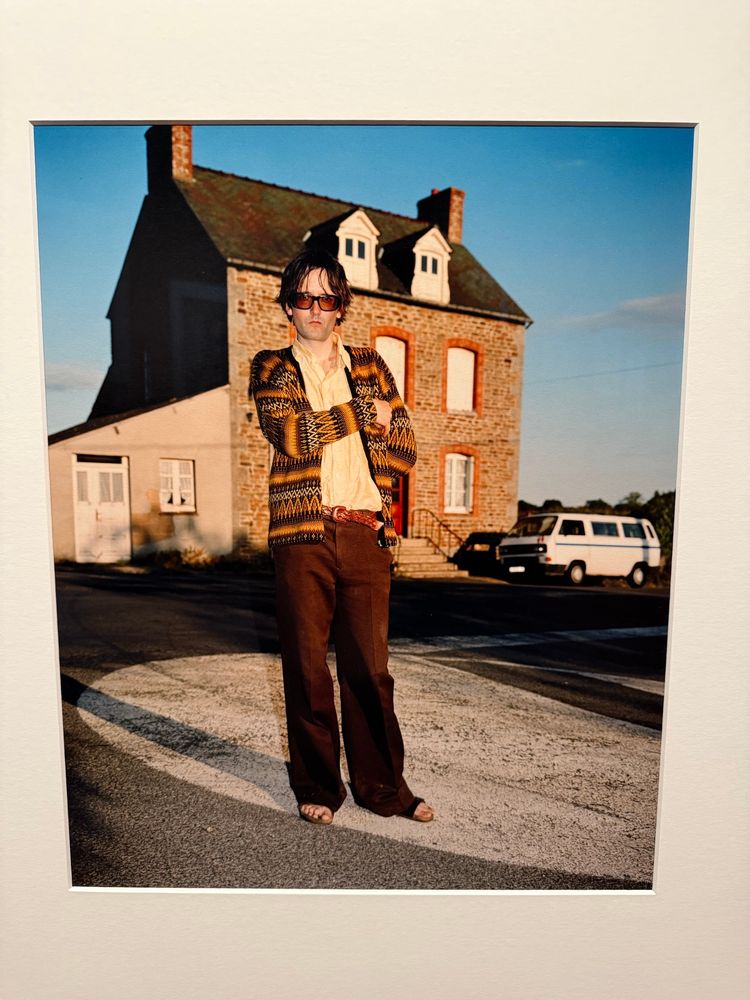 Photo of Jarvis Cocker from Pulp standing outside a detached house somewhere in Britain From  the Face, a magazine that f music and street/club style from late 20th century. 