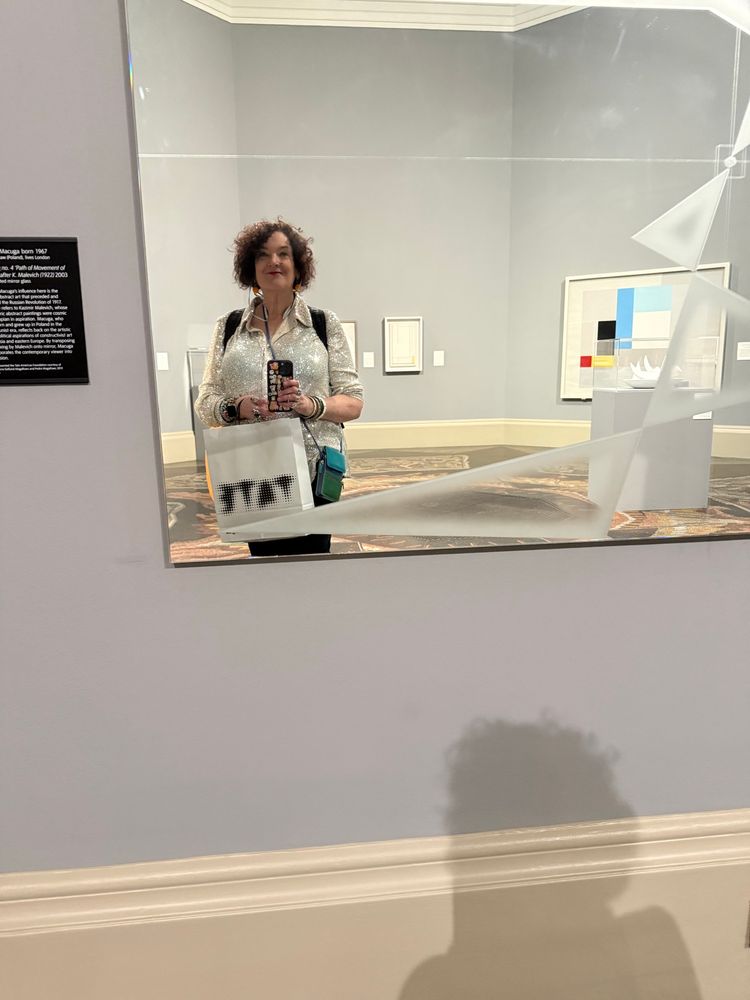 Myself in sequined blouse as reflected in a mirrored artwork at the Tate Gallery 