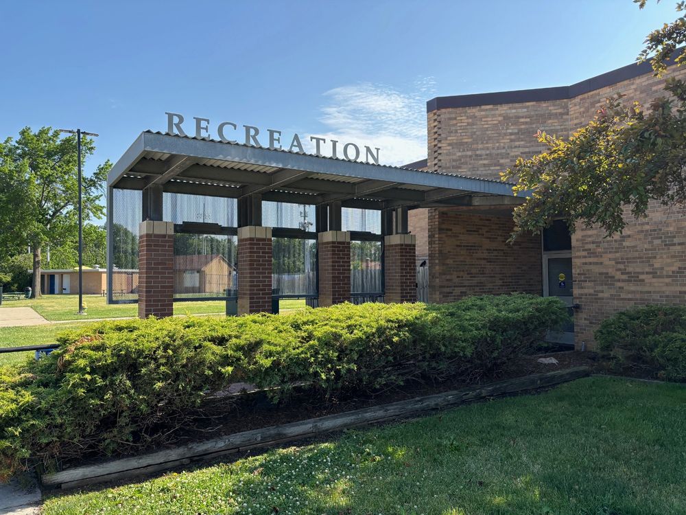 The exterior of the Oak Park Community Center. The word Recreation is on a sign above the entrance.