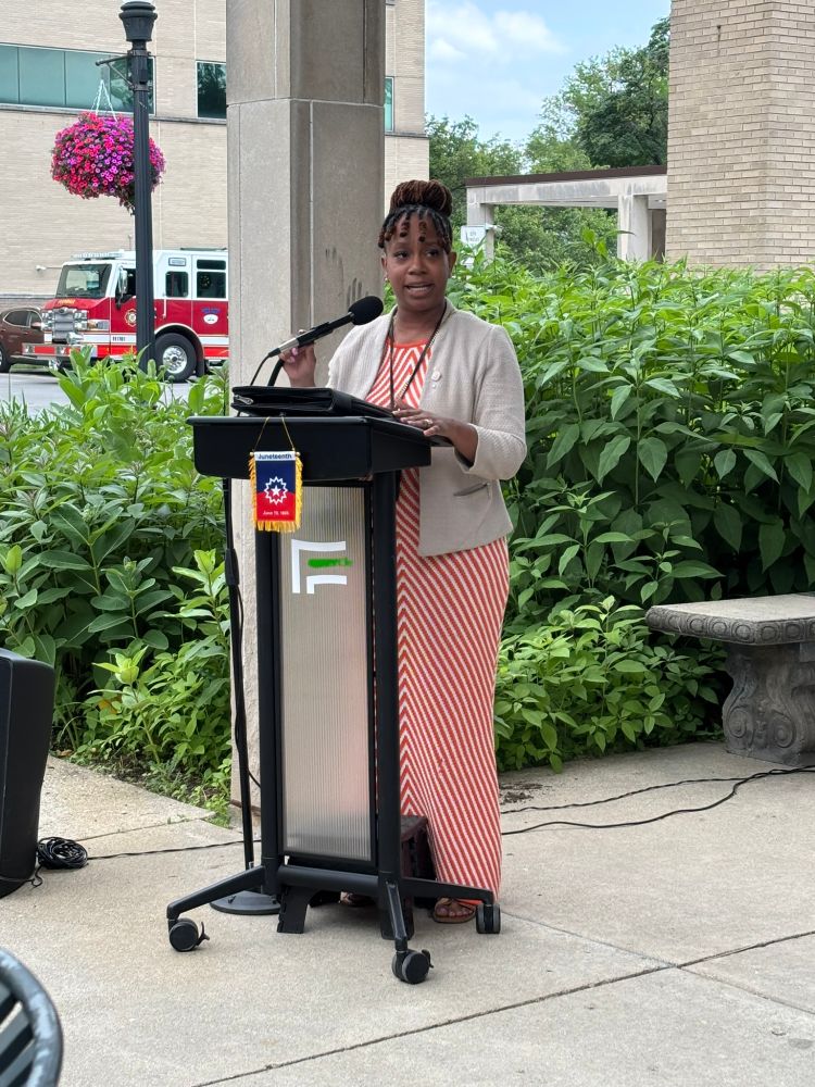 Dr. Hibbler stands at a podium.