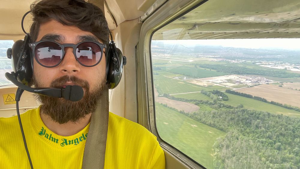 Me in the cockpit of C-152, flying over farms in Waterloo