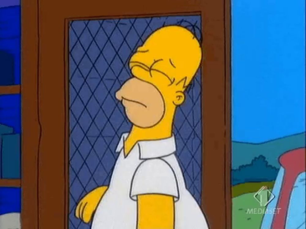 homer simpson from the simpsons is standing in front of a fence with his eyes closed ..