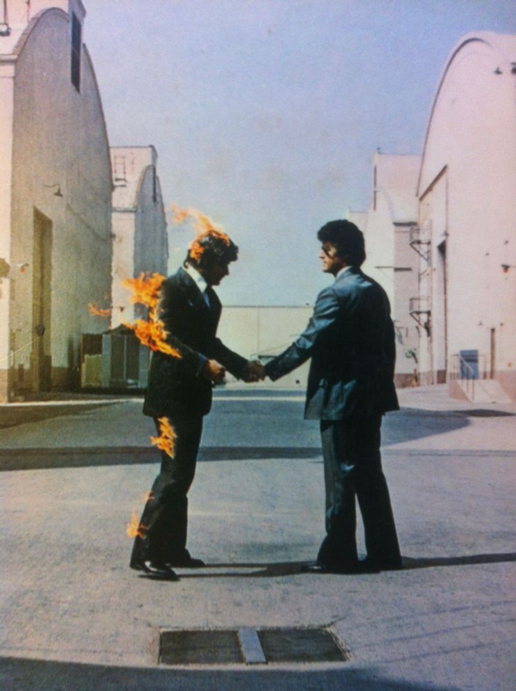 A flipped version of the famous album artwork for Pink Floyd’s “Wish You Were Here”