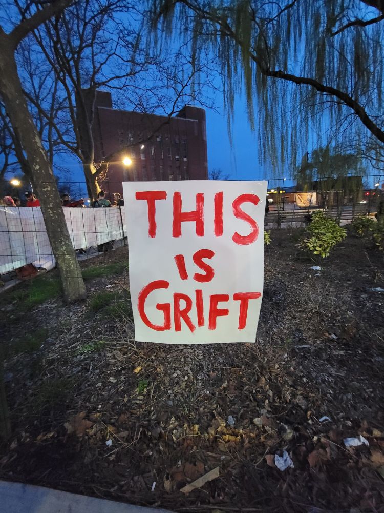 Handmade poster for a rally in Red Hook, Brooklyn, reads THIS IS GRIFT in a jaunty, Urine town style