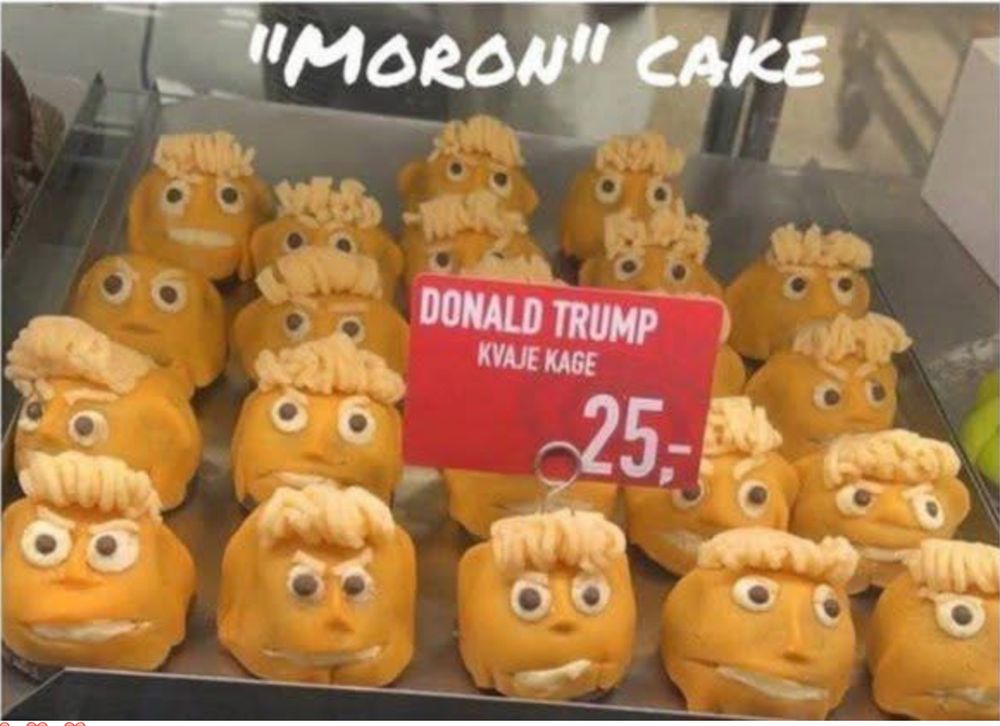 Orange-colored cake balls frosted with frosting as hair, and candy eyes.