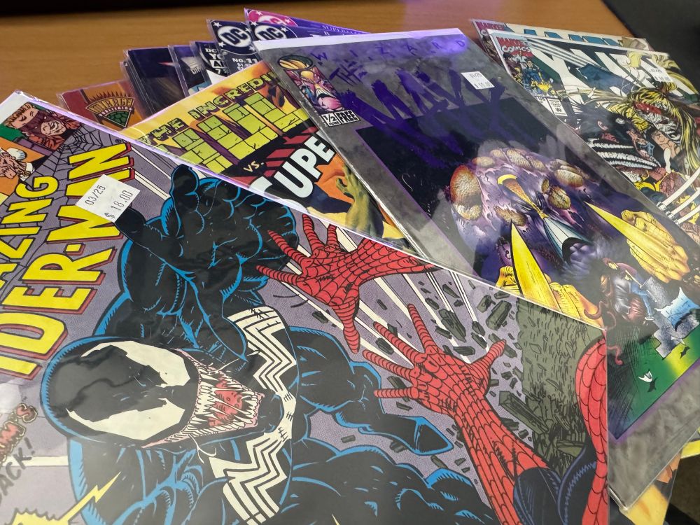 The comics I bought in a loose stack on my desk. Visible comics include Amazing Spider-Man 332, X-Men 5, The Maxx ½ and The Incredible Hulk vs. Superman.
