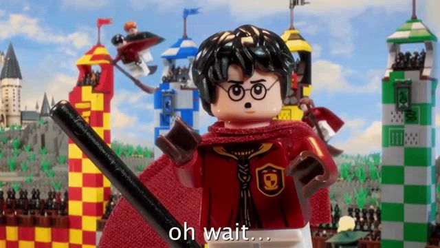 a lego harry potter character is holding a quidditch bat and says oh wait