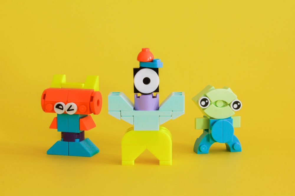 three tiny whimsical guys
