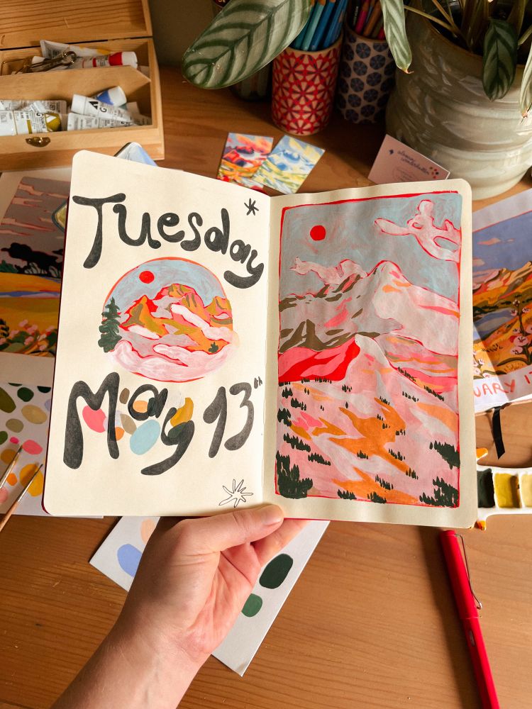 a gouache painting in my sketchbook. there’s two pinkish mountains with trees. 