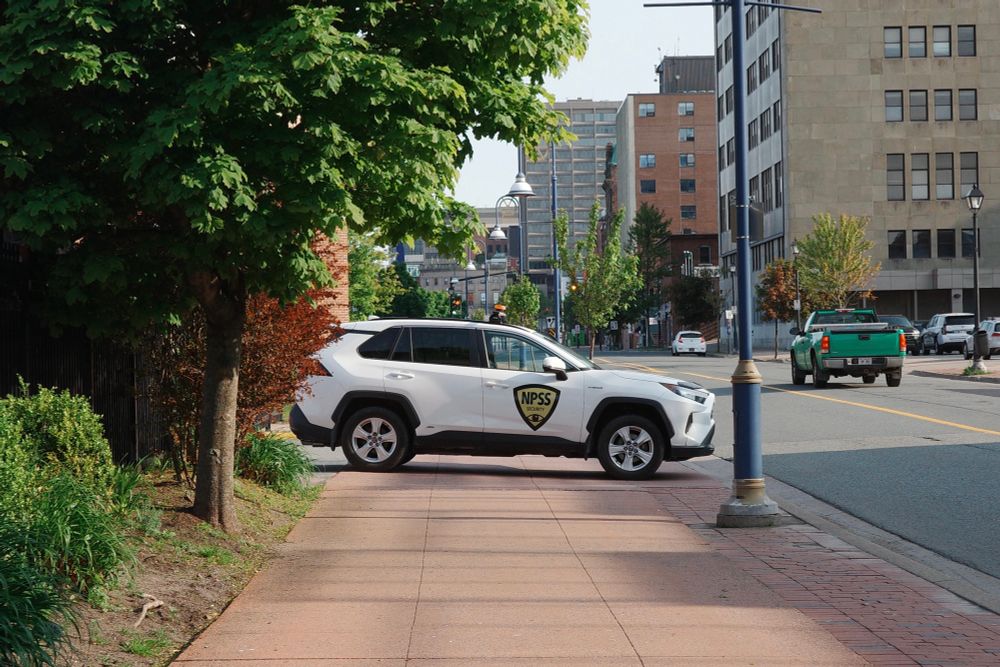Cruise cop parking and blocking the sidewalk.