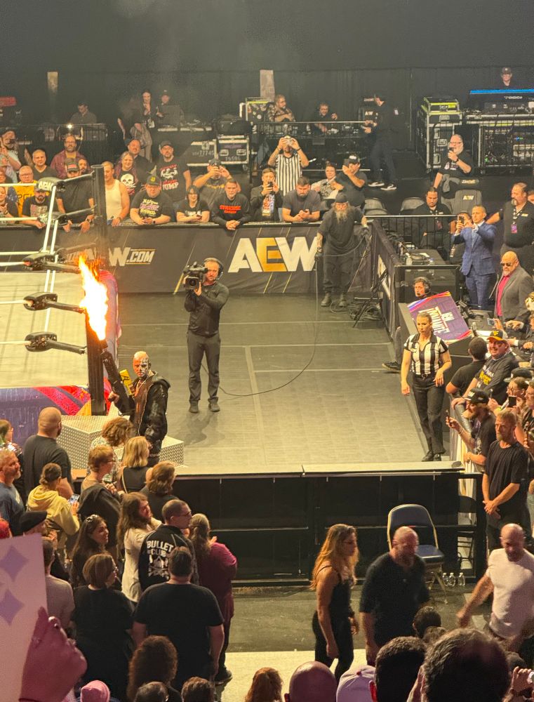 Darby Allin holds a flamethrower while the Death Riders flee at AEW Dynamite in Pittsburgh