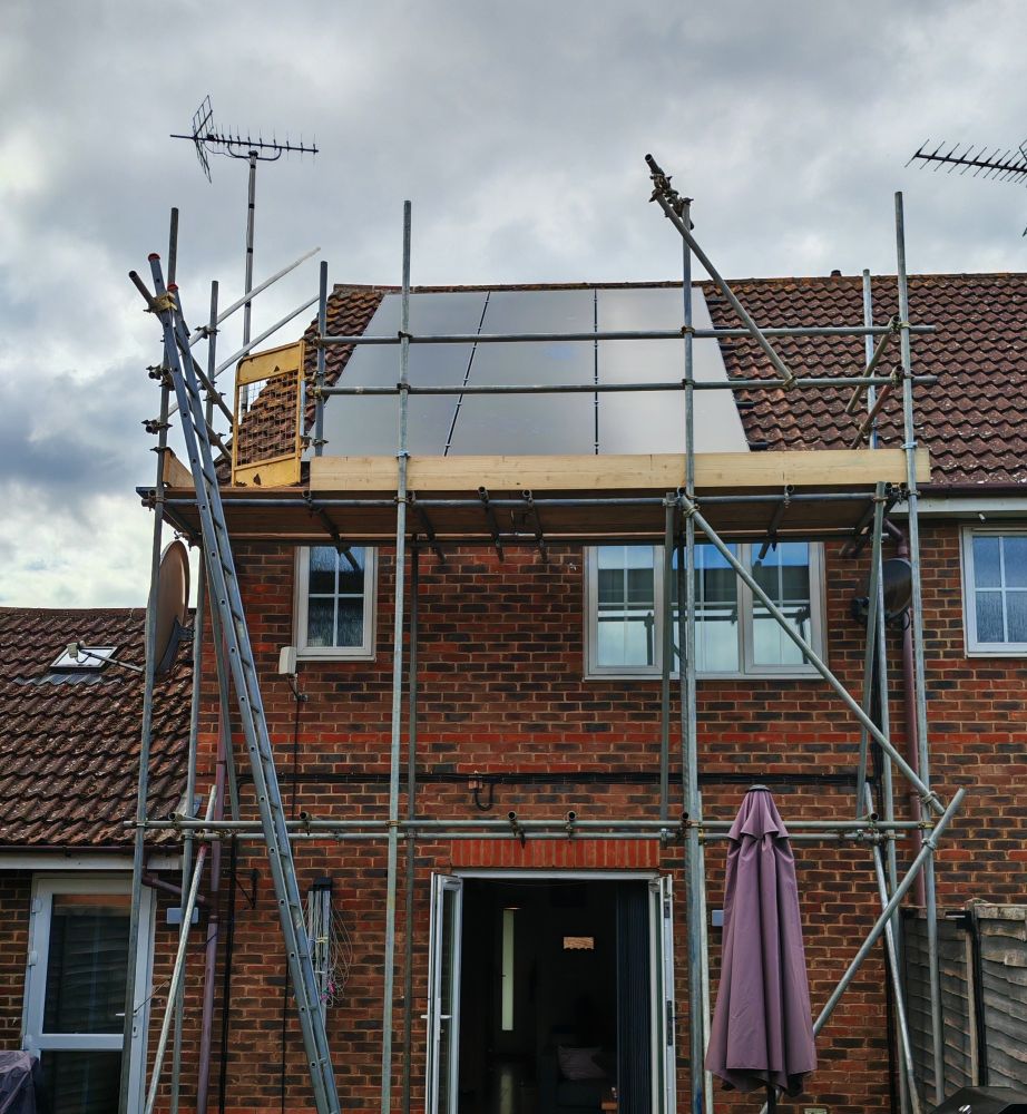 Roof with multiple solar panels installed.
