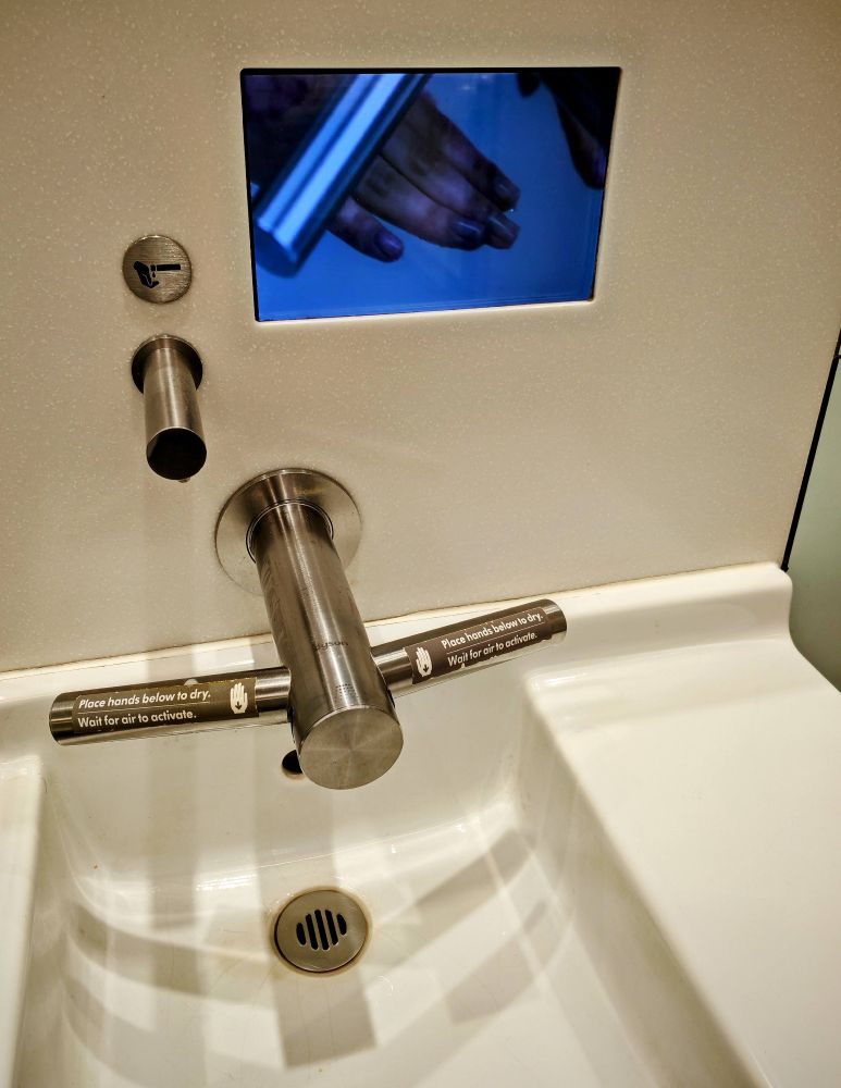 Dyson tap with integrated hand dryer. At Heathrow Airport.
