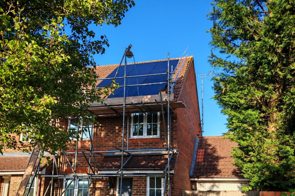 Roof with multiple solar panels installed.