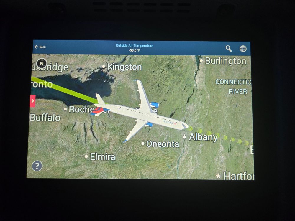 Moving map display on a Delta A321neo seatback with the plane rendered as if it was flying in a static +90° roll