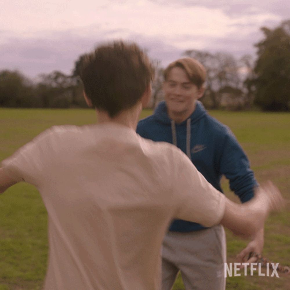 a netflix ad shows two boys playing a game of frisbee