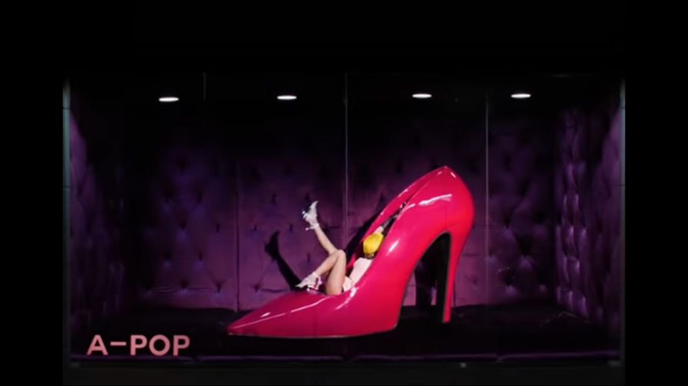 Screenshot of the new Tyla video with an A-POP sign