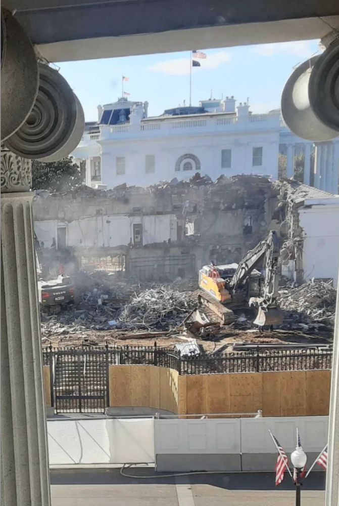 Large excavator demolishing the east wing of the White House. Entire ground floor is been removed and two basement floors are visible through the gaping hole in the People’s House