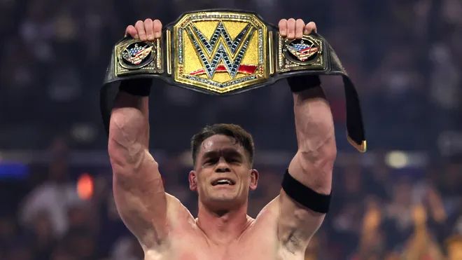 John Cena holding up Undisputed WWE Championship belt