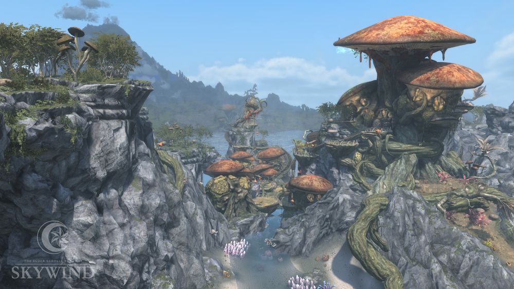 Picture of the landscape around Zafirbel Bay, consisting of tall, rough cliffs stretching out of tropical coral-filled waters. A large Telvanni mushroom tower sits atop one of the cliffs, with a group of smaller mushroom buildlings visible between the cliffs below it.